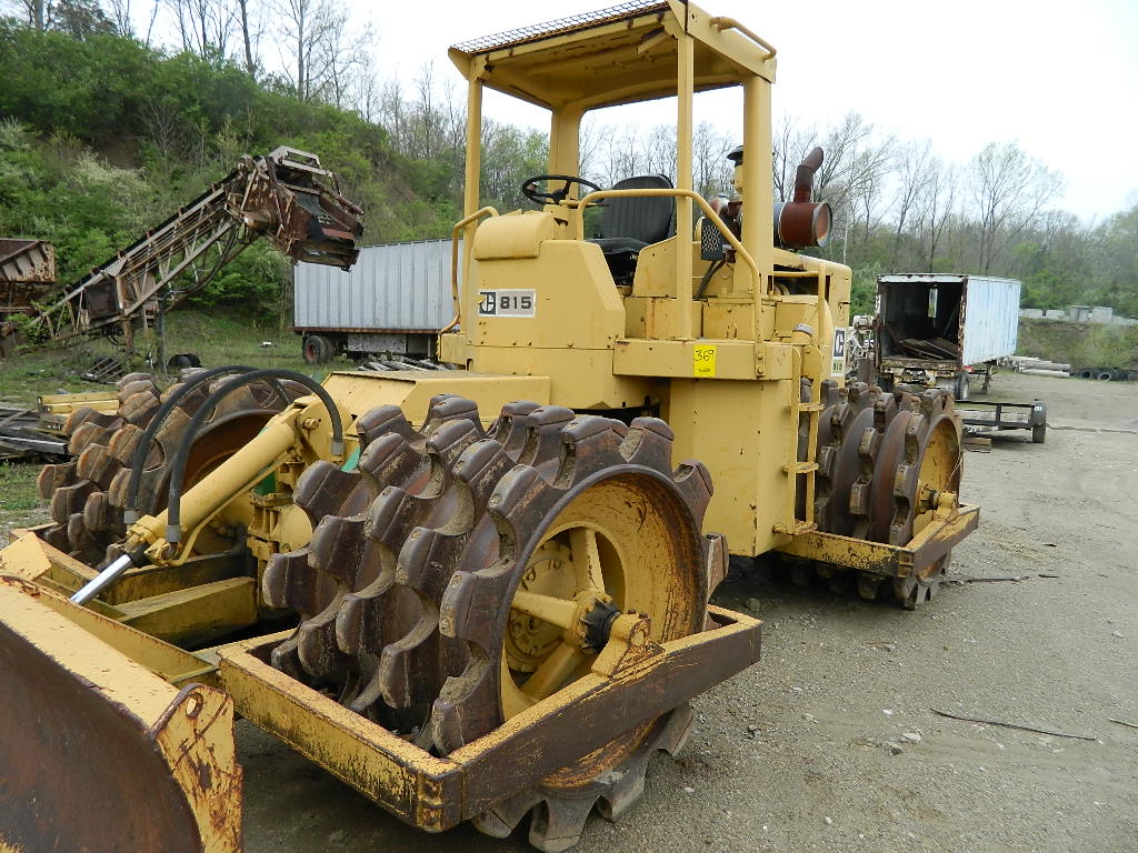 CAT 815 SHEEPS FOOT COMPACTOR, 12' SCRAPER, 38 WHEELS, 1,573 HOURS, S/N