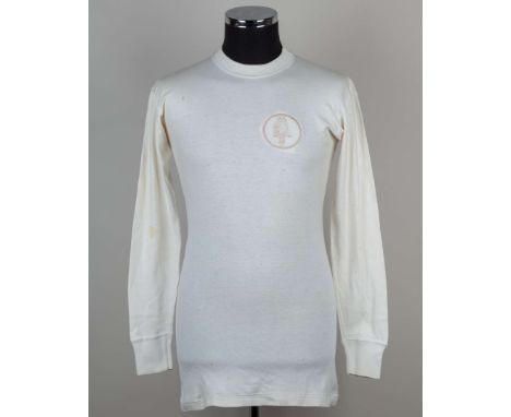 Billy Bremner white No.4 Leeds United long-sleeved shirt, 1967-68, Umbro, M, with crew-neck collar and embroidered badge, sta