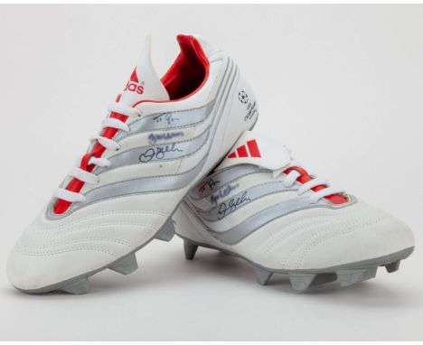 David Beckham signed pair of white and red Adidas Traxion Champions league football boots, both boots signed and dedicated by