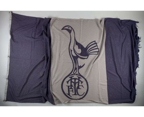 Three items related to Tottenham Hotspur, including a large bespoke blue rug with the Club badge picked out in gold, a Club f