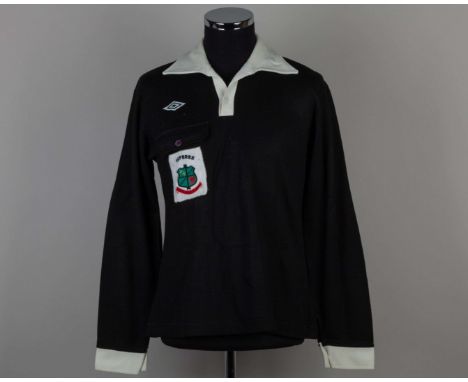 Black and white referee shirt, Umbro, with button-up collar and embroidered cloth badge inscribed REFEREE NORTH WALES COAST F