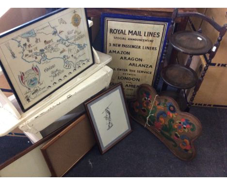 A white painted bench with shelf, three tier cake stand, three wooden frames, three framed pictures, one framed Royal Mail li