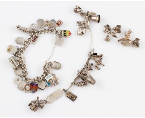 A curb link bracelet, stamped with lion passant, suspending multiple charms to include articulated examples, enamelled touris