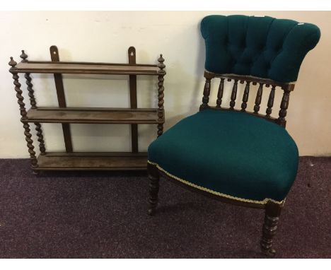 A mahogany three tier barley twist wall shelf, together with a turquoise nursing chair with open spindle back.