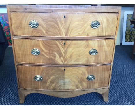 A 19th century mahogany bow fronted three drawer chest with bracket feet.