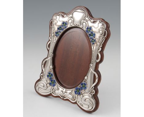 An Art Nouveau silver photograph frame, with later added blue and green enamel, with floral scrolling design, hallmarked Ches