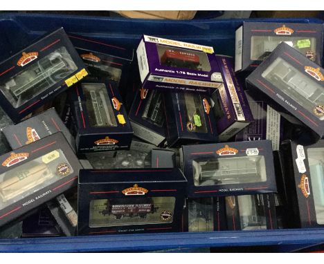 A carton containing a good quantity of boxed Bachmann and other rolling stock, wagons, trucks, brake van, BP oil tanker etc