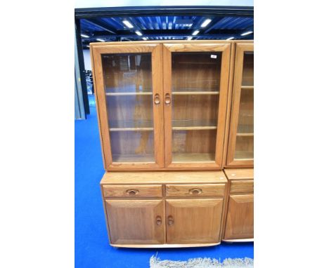 An Ercol lounge display having cupboard base, dimensions approx H162 D43 W91