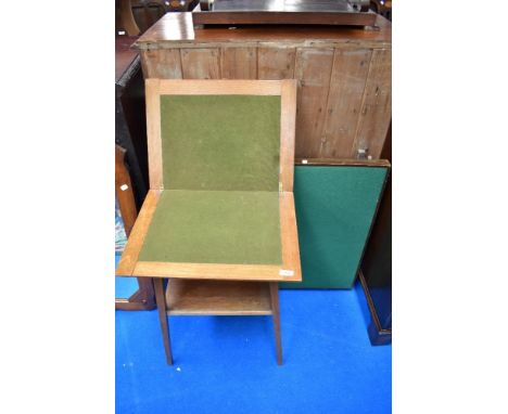 An early 20th Century golden oak Arts and Crafts style fold over card table and a traditional folding card table