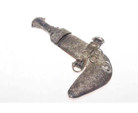 Arabian silver mounted ornate dagger and scabbard.