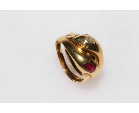 18 carat gold double snake ring set with ruby and diamond.