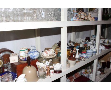Shelf of ceramics, mantel clock, glass.