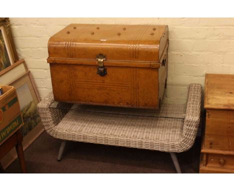 Rattan and glass topped coffee table and a tin trunk.