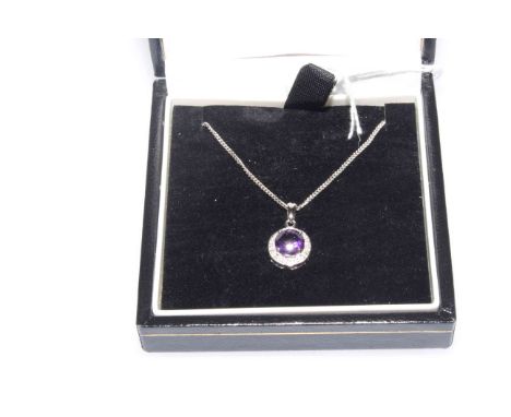 9 carat white gold, amethyst and diamond pendant with chain, boxed.