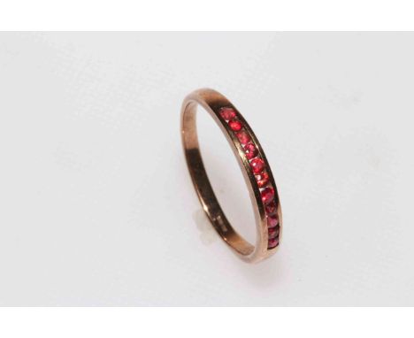 9 carat gold eleven ruby channel set ring, size Z.