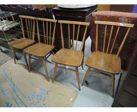 A set of four Ercol spindle back kitchen chairs, in mid stain