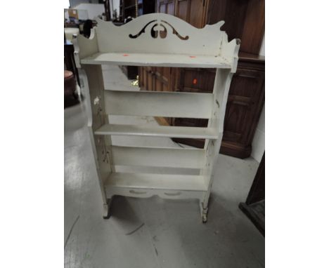 A small painted Art Nouveau style open bookshelf, width approx. 52cm