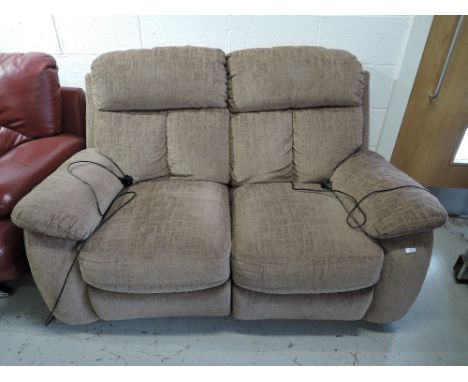 A two seater electric reclining sofa with good upholstery