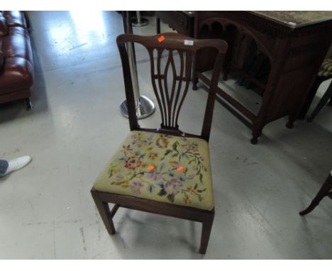 An early 19th Century mahogany dining chair having later tapestry seat