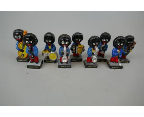 Collection of 9 Robertson Golly figurine.These items are listed on the basis they are illustrative of a bygone culture in whi