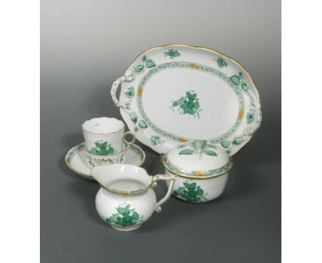 decorated in the 'Green Chinese Bouquet' pattern, comprising, twelve trembleuse cups, saucers and sideplates, a two-handled t