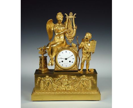 the classical style case with winged female playing a lyre, an attendant holding her music looks on, a triform pedestal with 