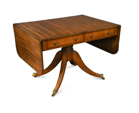 crossbanded in rosewood, on a turned pedestal column, four swept legs and brass cap casters, 71 x 175 x 75cmCondition report: