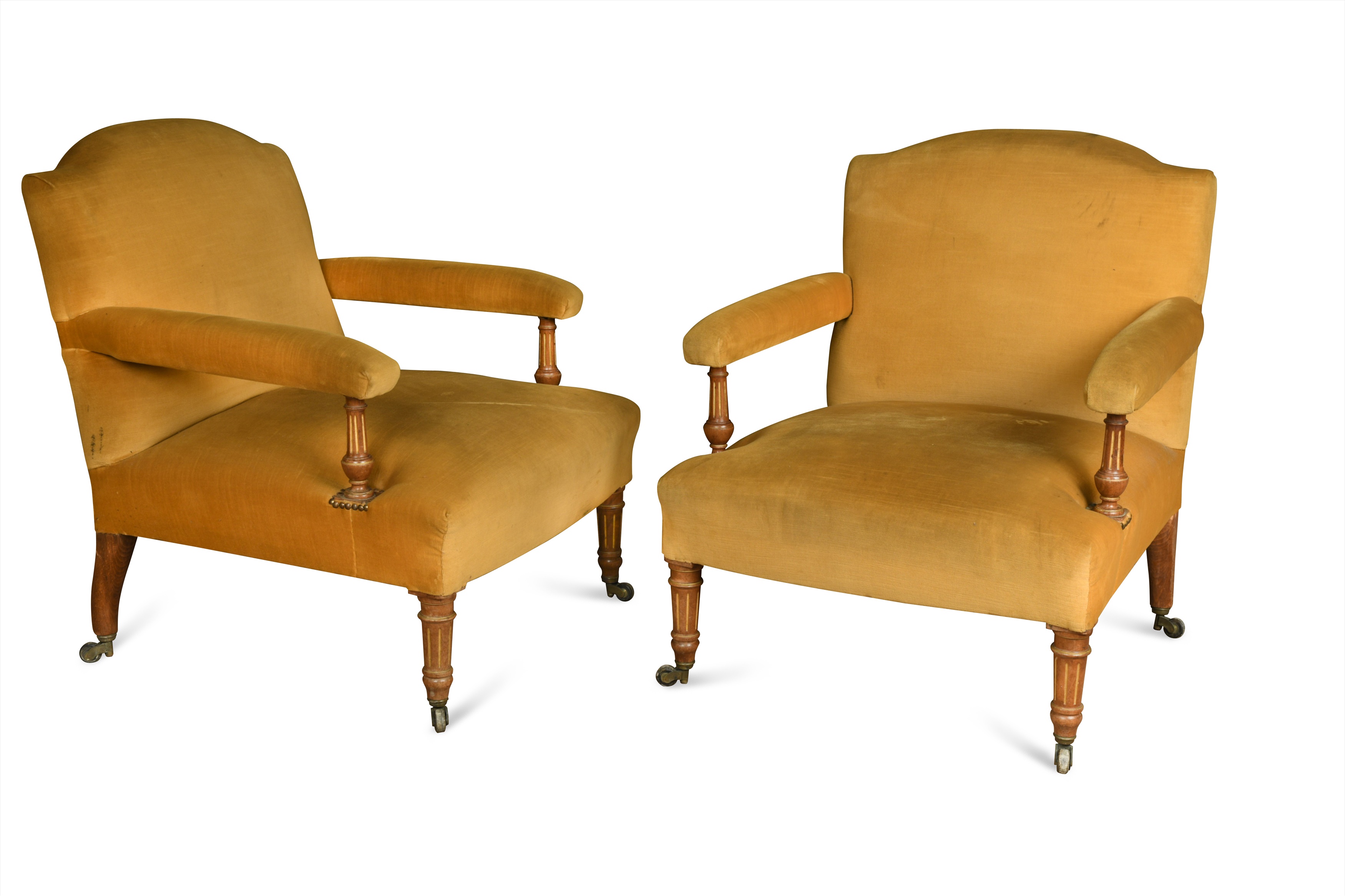 A pair of walnut and parcel gilt chairs in the manner of Holland and ...