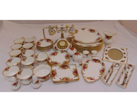 Royal Albert Old Country Roses dinner and tea service to include plates, cups, saucers, bonbon dishes, condiments, a photogra