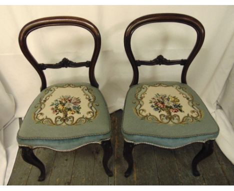 A pair of Victorian mahogany balloon back occasional chairs with tapestry seats on cabriole legs, height of back 83cm
