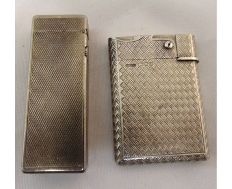 An engine turned silver cigarette lighter and a Dunhill cigarette lighter