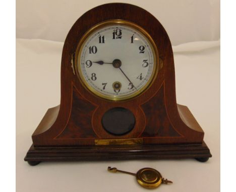 An early 20th century mahogany mantle clock, white enamel dial, Arabic numerals, to include pendulum