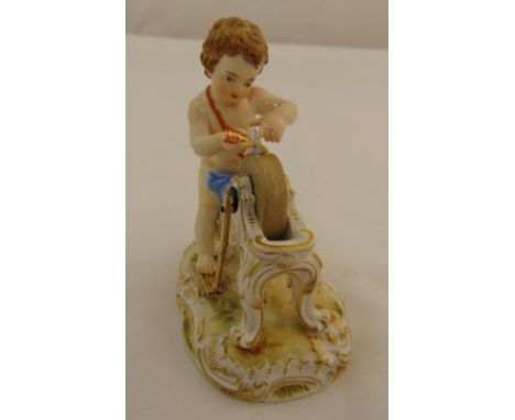 Meissen figurine of a putti sharpening his arrow, marks to the base, 11.5cm (h)