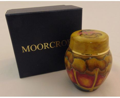 Moorcroft enamel miniature vase and pull off cover decorated with a sunset forest, marks to the base, in original packaging, 