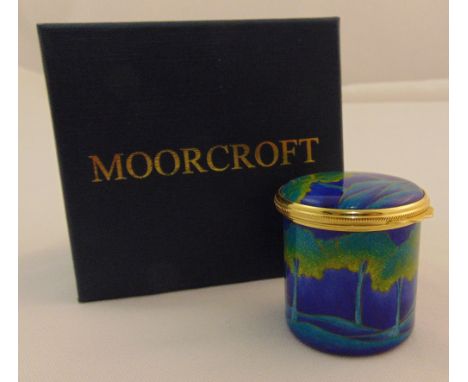 Moorcroft enamel moonlight blue circular box with hinged cover, marks to the base, in original packaging, 4cm (h)