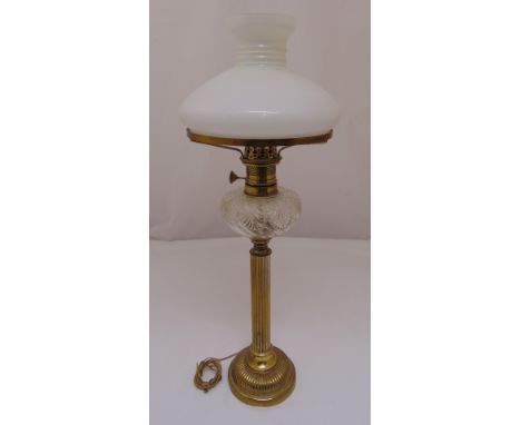 A Victorian brass oil lamp with frosted shade converted to an electric table lamp, 68.5cm (h)