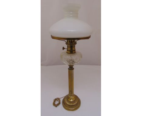 A Victorian brass oil lamp with frosted shade converted to an electric table lamp, 68.5cm (h)