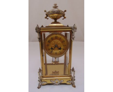 A French 19th century four glass and gilded metal chiming mantle clock, two train movement with mercury pendulum, gilded dial