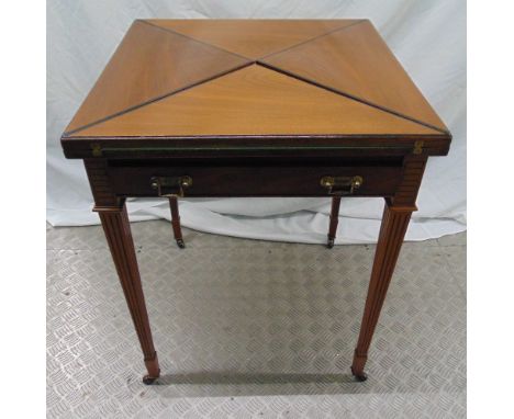 A mahogany envelope card table with single drawer on four tapering rectangular legs with original castors, 75 x 59.5 x 59.5