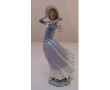 Lladro figurine of Windswept girl holding her hat, marks to the base, 35cm (h)