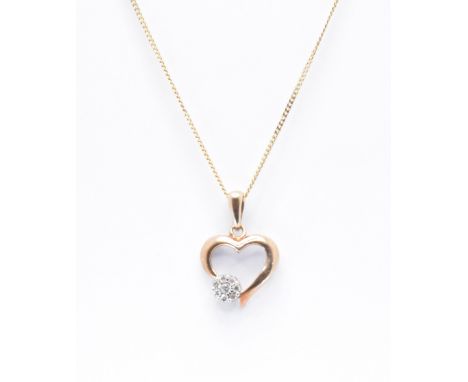 A 9ct gold and diamond pendant necklace. The necklace strung with a pendant in the form of a heart having a cluster of diamon