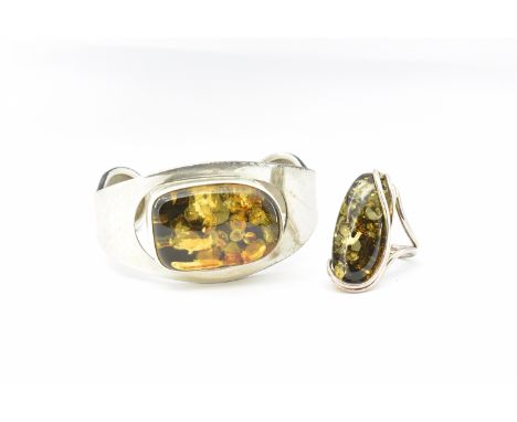 A&nbsp; hallmarked 925 silver and amber torque bangle and ring.&nbsp; The bangle having a bezel set amber cabochon&nbsp; with