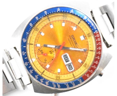 A Seiko chronograph automatic wrist watch. The watch having a gilt face with baton markings to the chapter ring, rotating blu