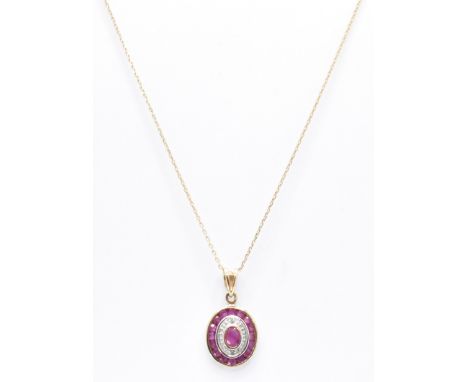 A hallmarked 9ct gold and ruby pendant necklace. The necklace strung with a ruby set pendant upon a fine strace chain. Hallma