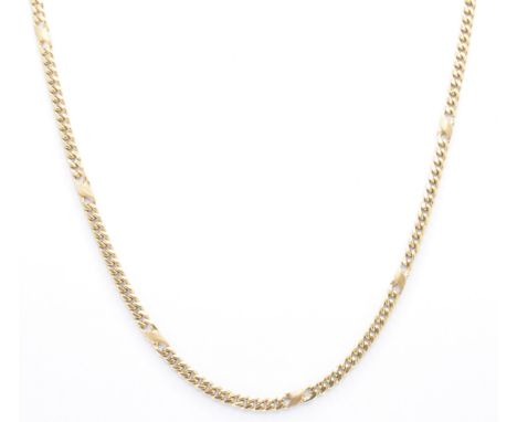 A hallmarked 9ct gold chain necklace. The necklace formed of flat curb and figure of eight links united by lobster claw clasp