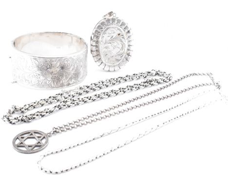 A collection of silver jewellery. The jewellery to include a silver hallmarked locket of large proportions (hallmarked 1979),