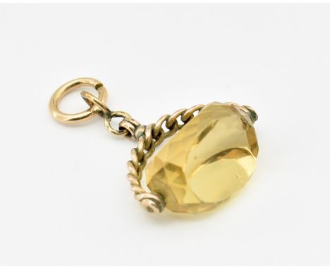 A 19th century Victorian 9ct gold and citrine swivel fob. The antique fob strung with faceted citirne upon chain style mount 