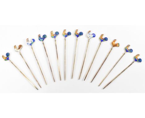 A set of twelve vintage silver and enamelled cocktail sticks. The cocktail sticks having enamelled cockerel finials set withi