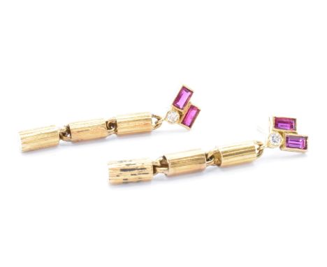 A pair of 14ct gold diamond and ruby Art Deco style drop earrings. The earrings each having two baguette cut rubies and a sin