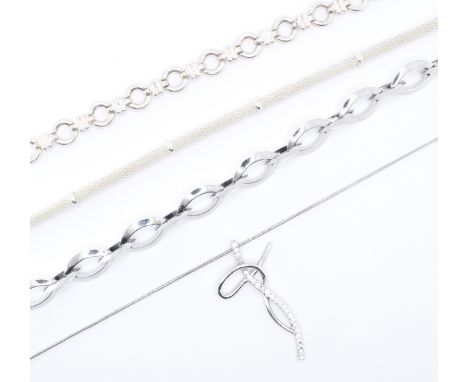 A collection of silver necklaces to include a snake chain pedant necklace set with white stones and a mesh chain necklace. Lo
